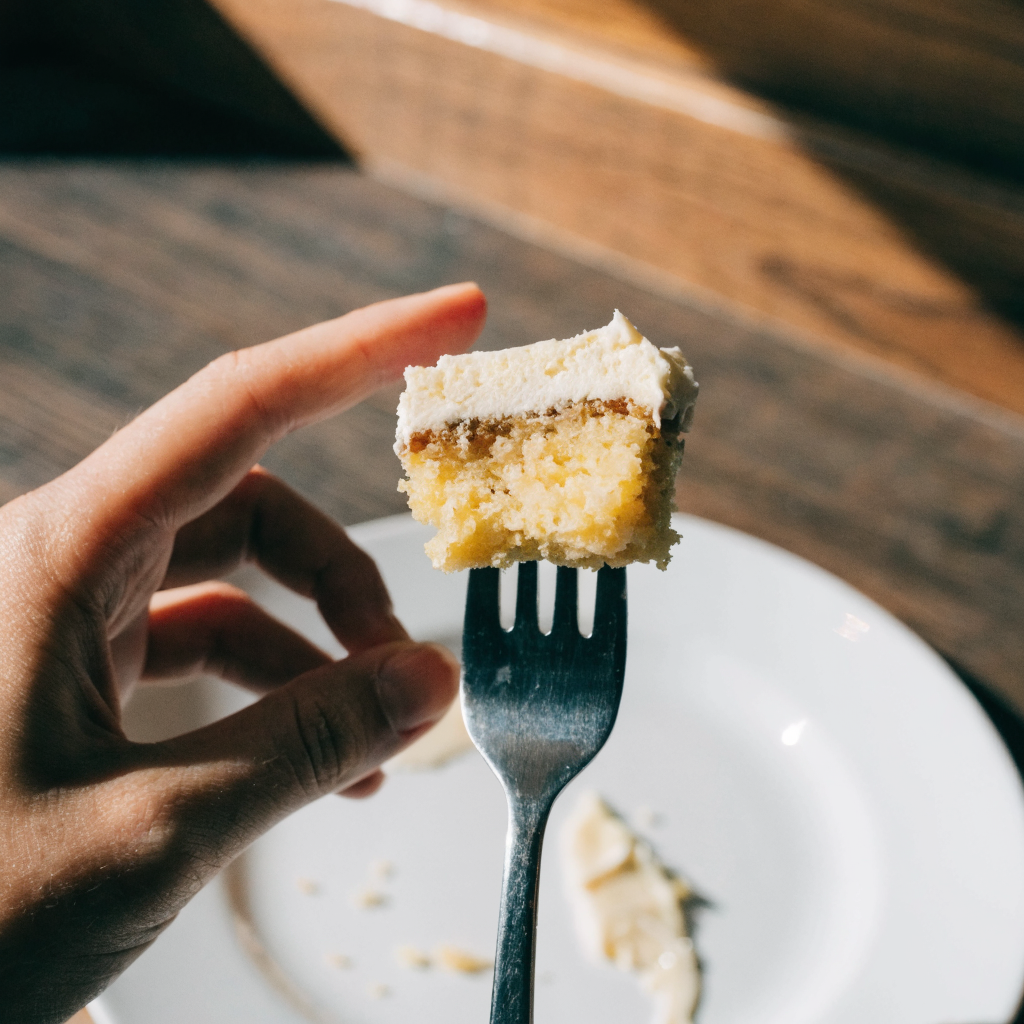 Close-up of cinnamon zucchini cake with cream cheese frosting