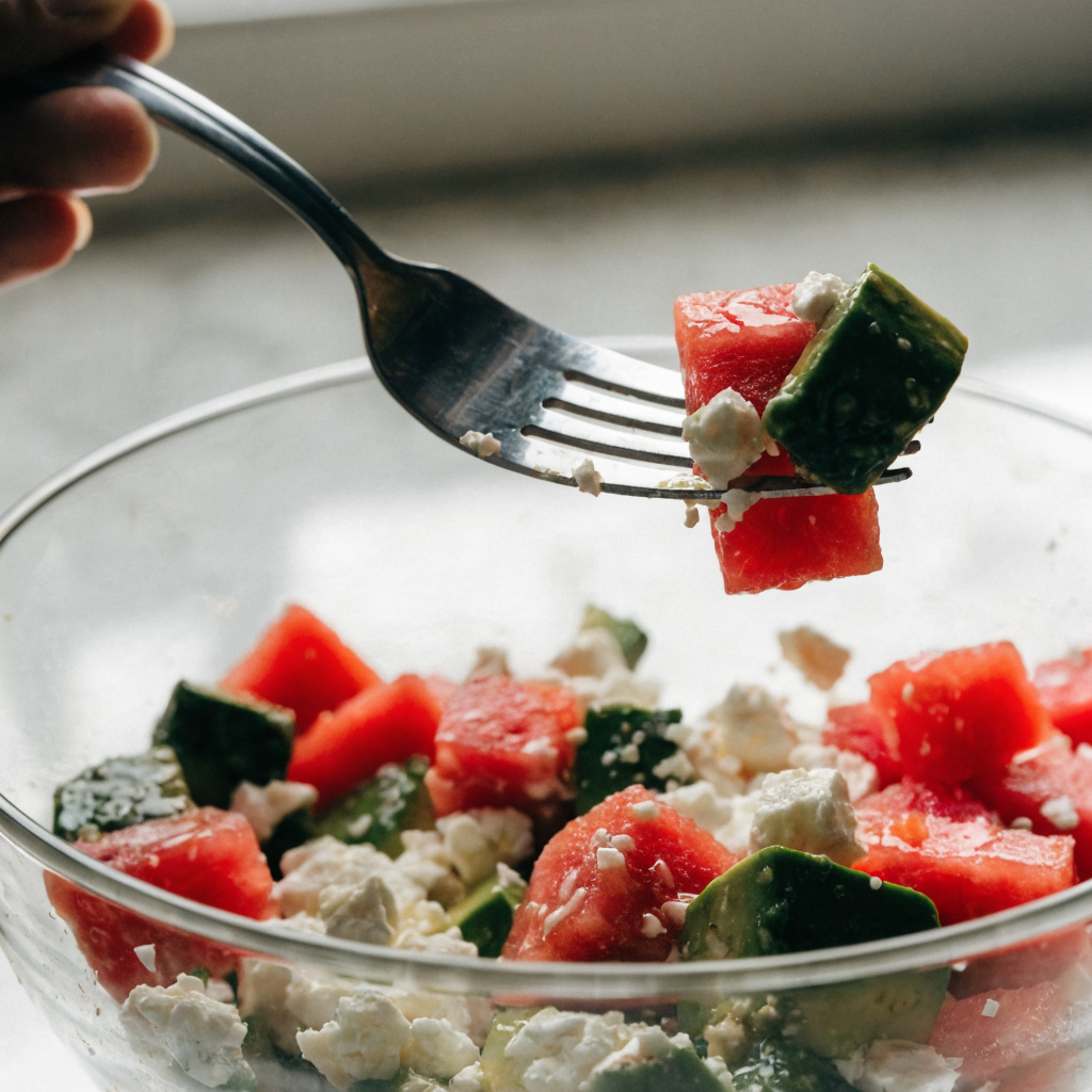Close-up of watermelon avocado salad with feta and mint